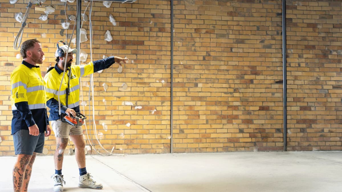ICGC team members Daniel and crew in branded uniforms at a James St Burleigh commercial project