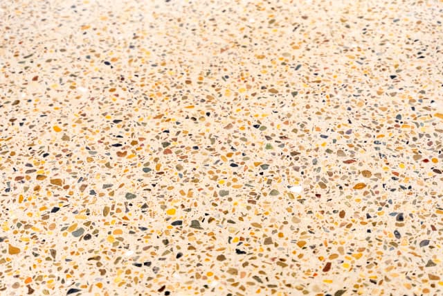 Detail shot of a freshly honed concrete floor showing the quality of the finish