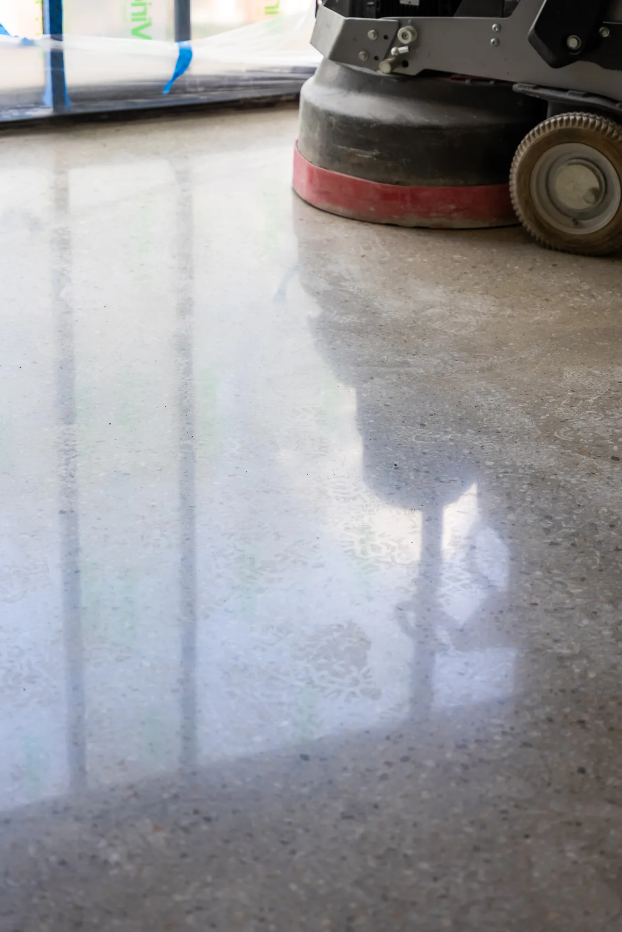 Brisbane polished concrete floor showing mirror-like reflection of the surrounding commercial space