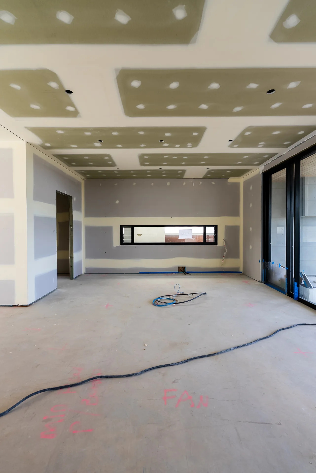 Brisbane commercial open-plan space with finished polished concrete floor and floor-to-ceiling glass