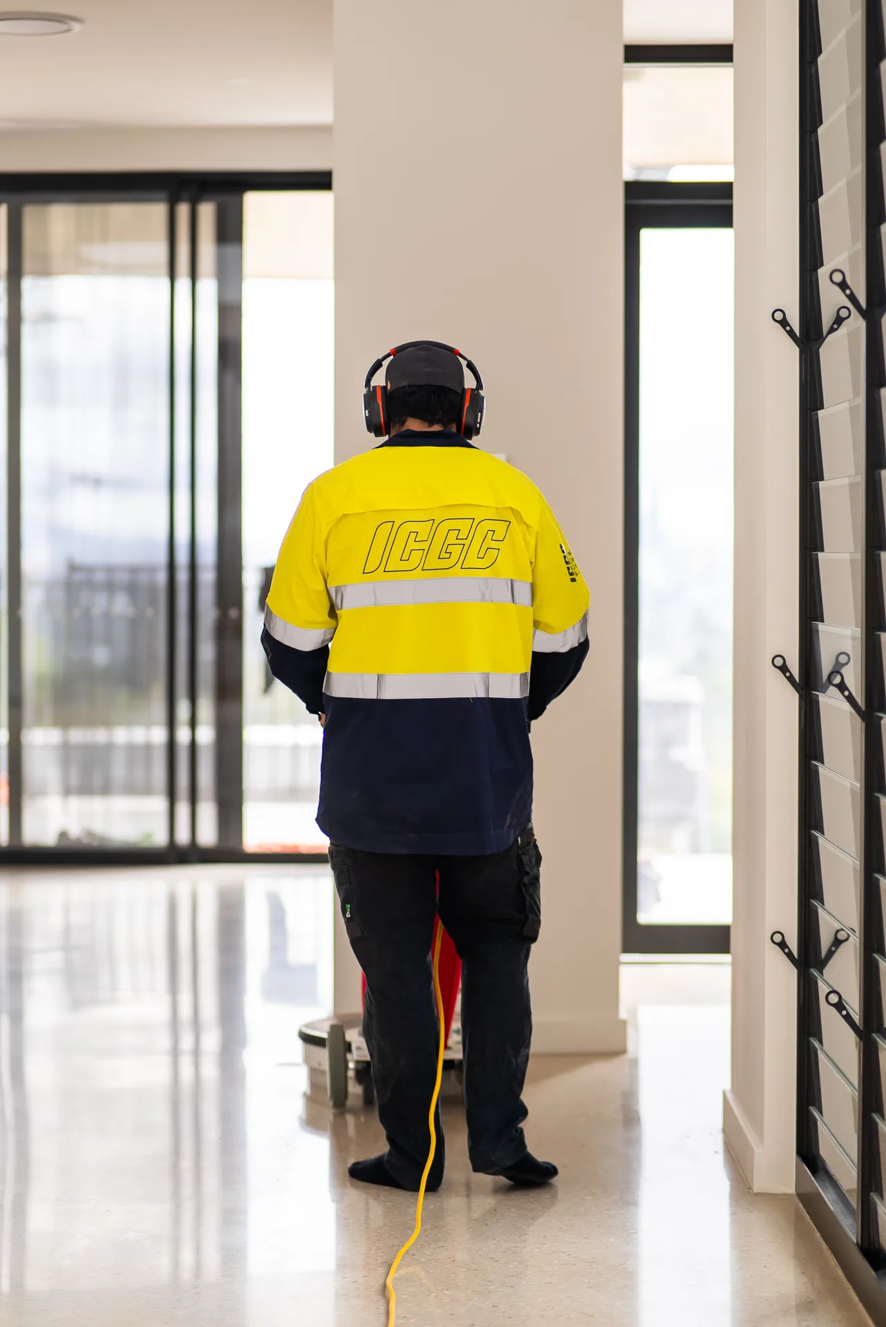 Planetary grinder polishing a residential concrete floor on a Brisbane project