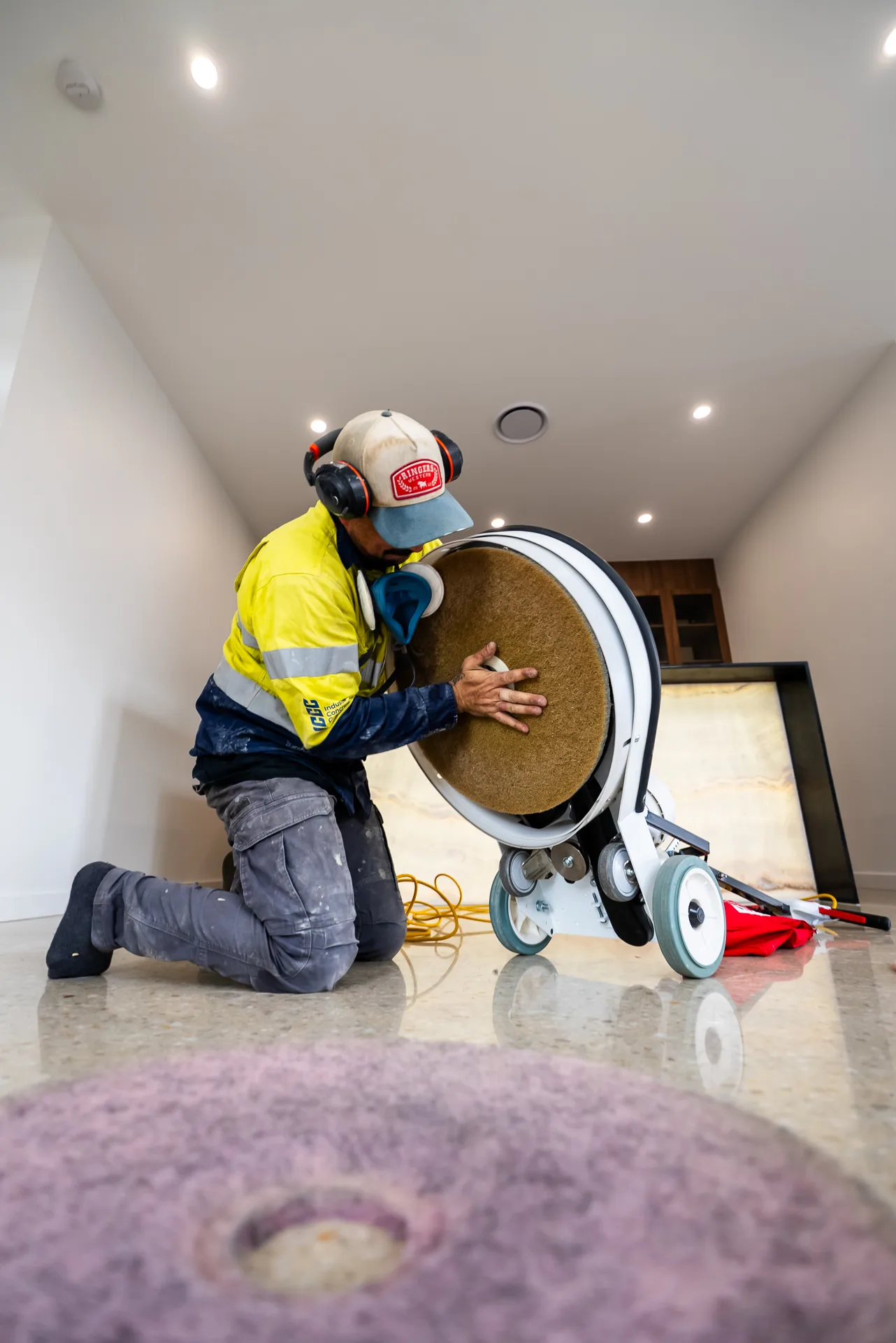 ICGC operator polishing a concrete floor during a new build in Brisbane